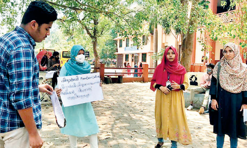 Protest against Ramachandran Commission report depriving students of travel rights