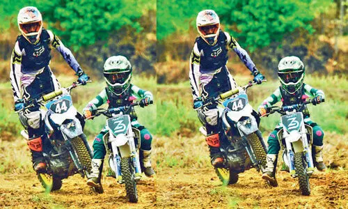 Six-year-olds bike mud race training