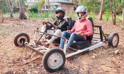 School students building a sports car