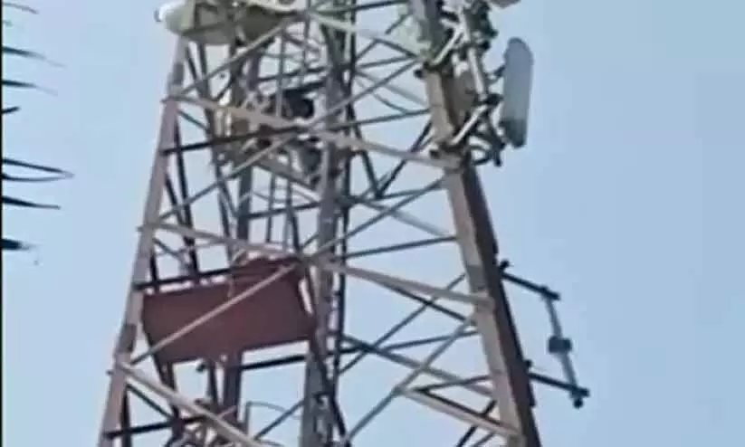 young man threatened to commit suicide by climbing on top of the mobile tower- reason is hilarious