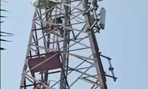 young man threatened to commit suicide by climbing on top of the mobile tower- reason is hilarious