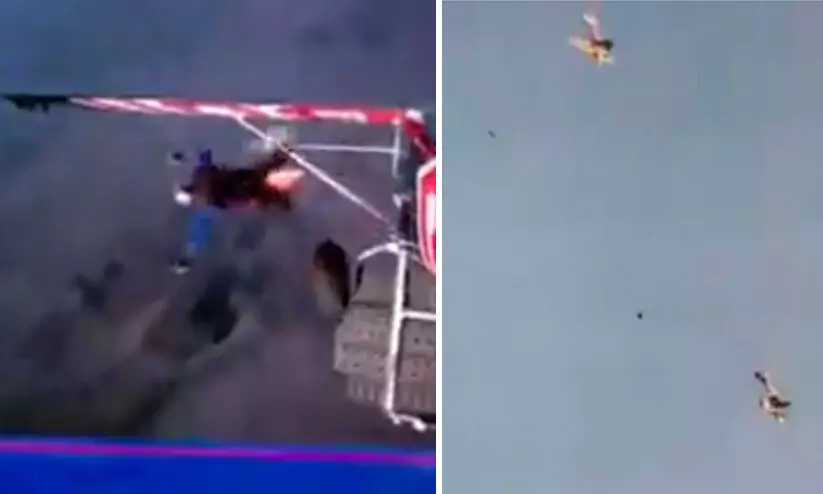 ആകാശത്ത് വിമാനങ്ങളിലേക്ക് പരസ്പരം മാറിച്ചാടാൻ പൈലറ്റുമാരുടെ ശ്രമം; വൈറലായി വീഡിയോ ആകാശത്ത് വിമാനങ്ങളിലേക്ക് പരസ്പരം മാറിച്ചാടാൻ പൈലറ്റുമാരുടെ ശ്രമം; വൈറലായി വീഡിയോ