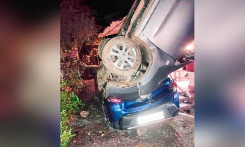 Car overturned on the porch of the house