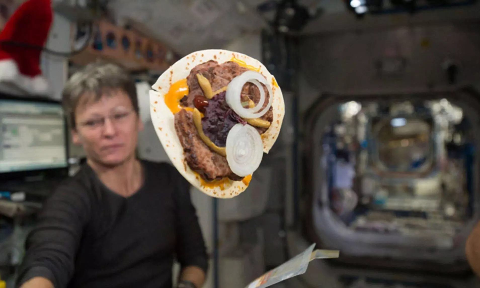 astronauts eating drinking and sleeping in space