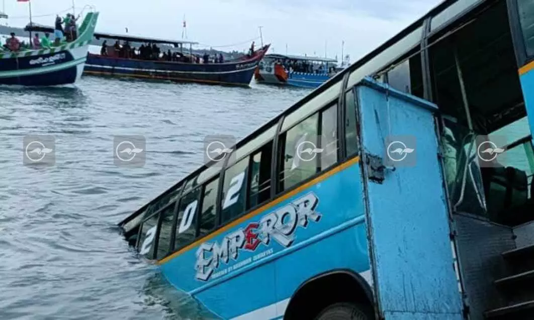 bus overturned into river