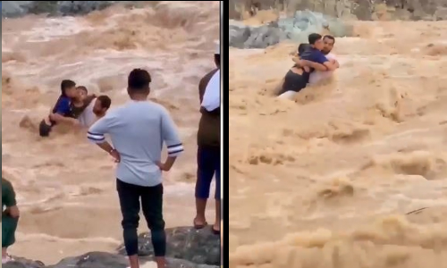 കുതിച്ചൊഴുകിയ വാദിയിൽ കുടുങ്ങിയ കുട്ടികളെ സാഹസികമായി രക്ഷിച്ച് സ്വദേശി യുവാവ് -VIDEO