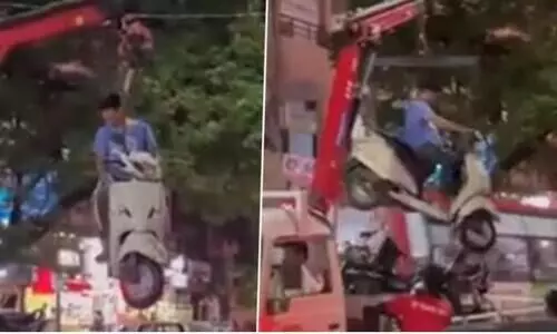 Nagpur traffic police lift scooter from no parking zone with its owner atop, see viral video