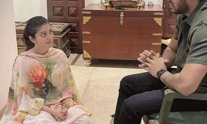 Never Ever: Image of Actress Sitting At Her Husband’s Feet