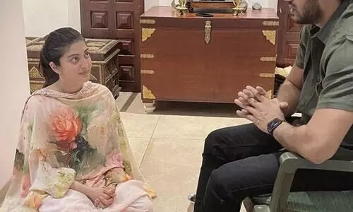 Never Ever: Image of Actress Sitting At Her Husband’s Feet