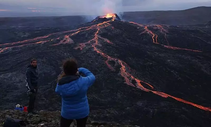 Lava spills out as volcano erupts in Iceland