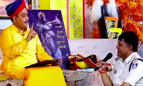 Cop Takes Guidance From Godman