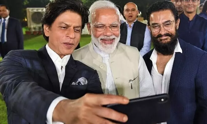 Shah Rukh Khan requests PM Narendra Modi to take a day off in his birthday wish Shah Rukh Khan requests PM Narendra Modi to take a day off in his birthday wish