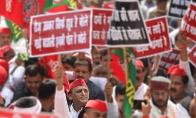Samajwadi Party chief Akhilesh Yadav along with other party members during protest march in state capital on Monday.