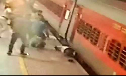 Cops rescue man trapped between train & platform at Coimbatore Railway Station; Cops rescue man trapped between train & platform at Coimbatore Railway Station;