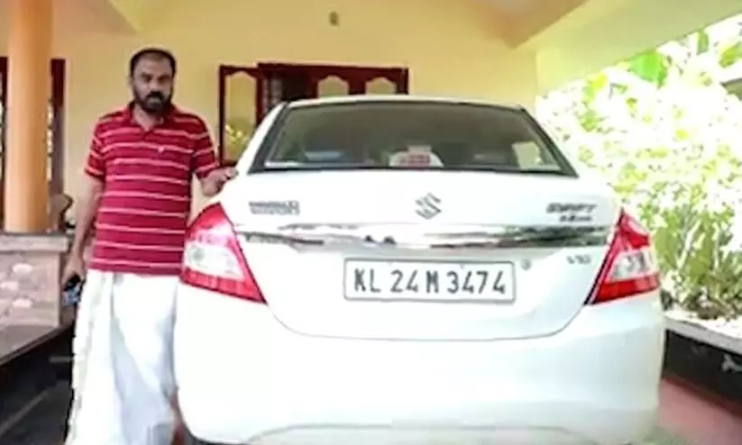 The traffic police fined the car driver for not wearing a helmet