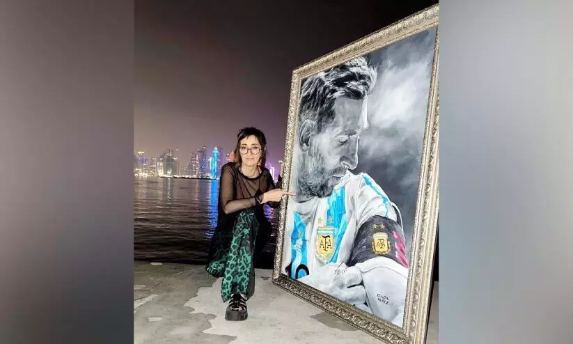 Claudio Perez with paintings of Lionel Messi Claudio Perez with paintings of Lionel Messi