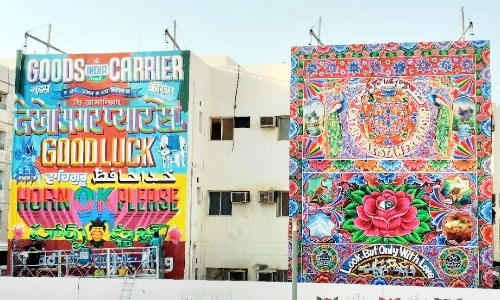 Indian and Pakistani artists paint trucks on walls