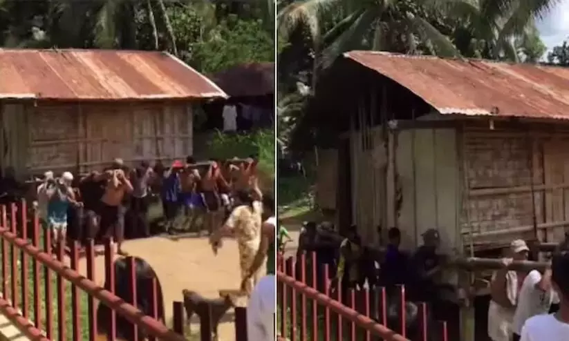 Locals carry elderly mans house on their shoulders in Philippines Locals carry elderly mans house on their shoulders in Philippines