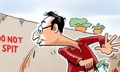 Ban on spitting in road