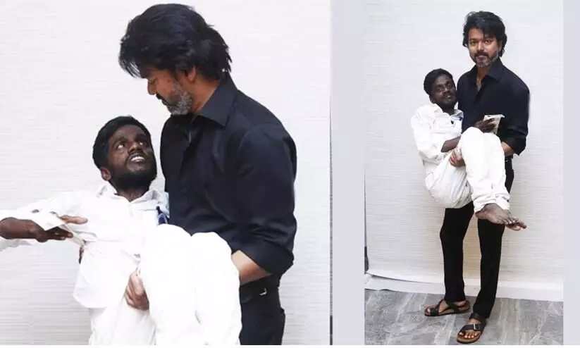 ശാരീരിക വെല്ലുവിളി നേരിടുന്ന ആരാധകനെ വാരിയെടുത്ത് വിജയ്; ചിത്രം വൈറൽ