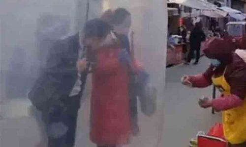 In China, couple’s makeshift ‘shield’ against Covid-19 outbreak is viral