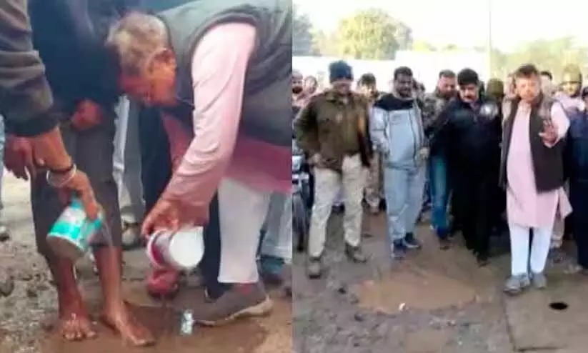 Minister washes feet of person to apologise for bad condition of road Minister washes feet of person to apologise for bad condition of road