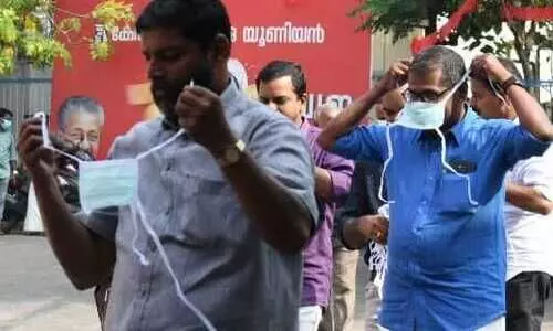 Kerala Govt makes masks sanitizers mandatory