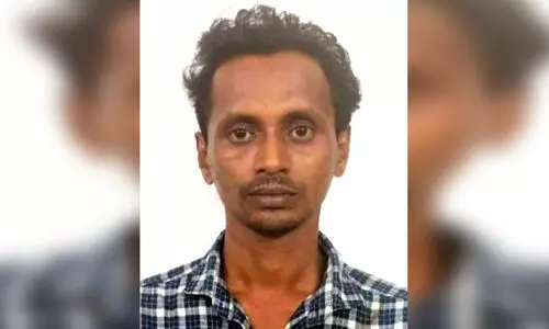 Hotel employee arrested for robbery