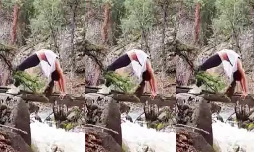 ഒഴുകുന്ന പുഴക്ക് കുറുകെ യുവതിയുടെ യോഗാഭ്യാസം -വൈറലായി വിഡിയോ