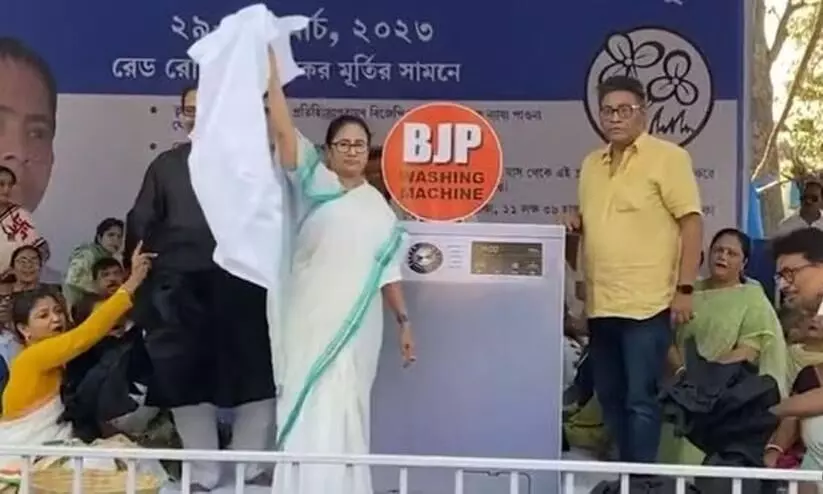 Mamata Banerjee uses washing machine as prop, takes dig at BJP during protest