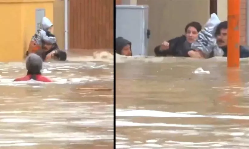 Neighbours brave rising flood waters to rescue mother-daughter in Italy