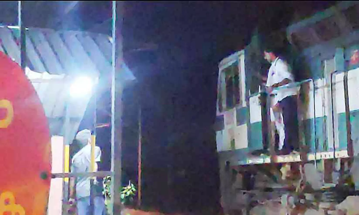 A train with only an engine arrived at the open gate