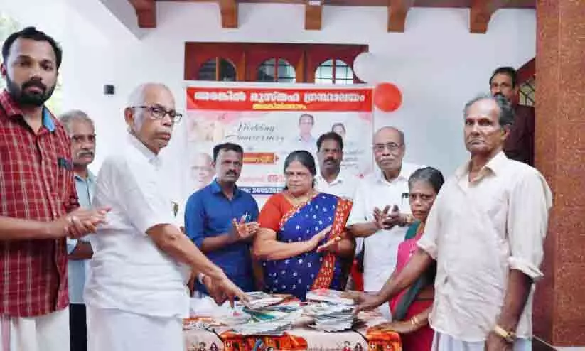 Couple donates books to library on wedding anniversary
