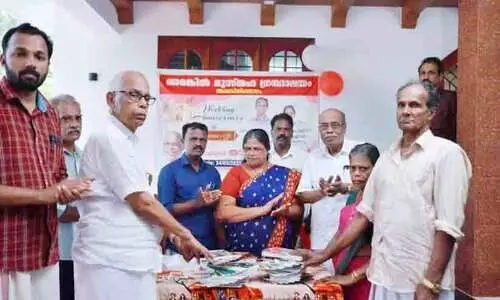 Couple donates books to library on wedding anniversary
