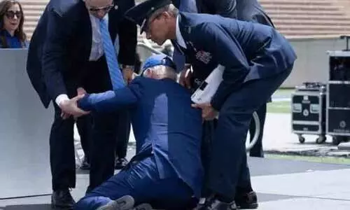 US President Joe Biden trips and falls at Colorado event