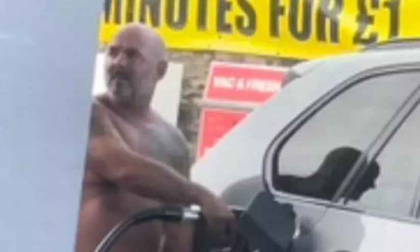 Driver Hops Out Of Car and Fills Up Tank Completely Naked