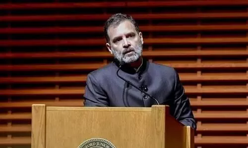 Rahul: Modi driving Indian car looking at rear-view mirror