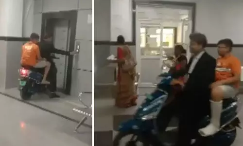 വീൽചെയറില്ല; ആശുപത്രിയുടെ മൂന്നാം നിലയിലേക്ക് സ്കൂട്ടറോടിച്ച് കയറ്റി യുവാവ്