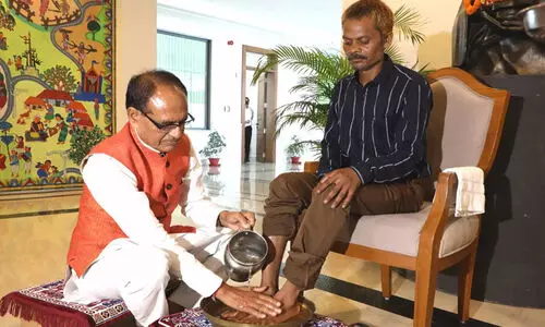Shivraj Singh Chouhan washes feet of urination incident victim