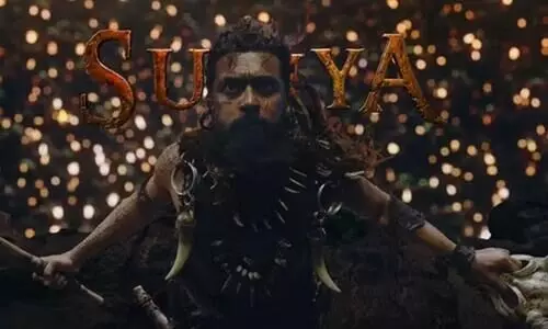 Kanguva first glimpse: Suriya sports long hair as a fierce warrior;