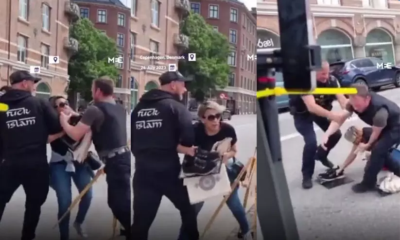 കത്തിക്കാൻ ശ്രമിച്ചവരുടെ കൈയ്യിൽ നിന്ന് ഖുർആൻ പിടിച്ചുവാങ്ങി ഡാനിഷ് വനിത; വിഡിയോ വൈറൽ