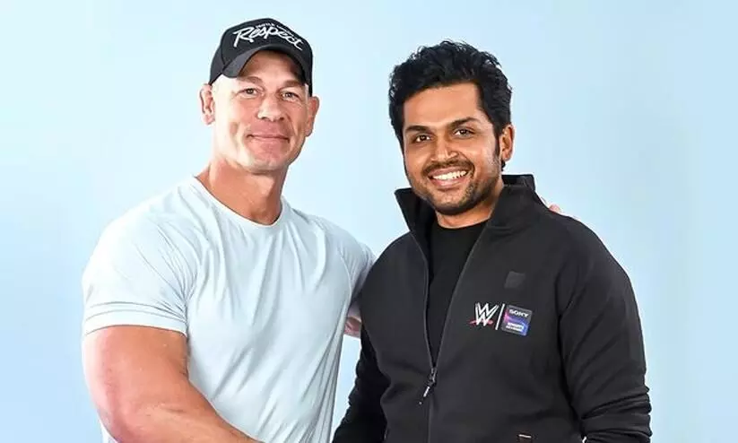 Karthi meet  John Cena  for wrestling event,uring Hyderabad stay