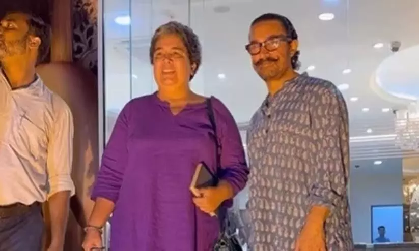 Aamir Khan, ex-wife Reena Dutta are all smiles as they pose for photographers outside Mumbai jewellery shop