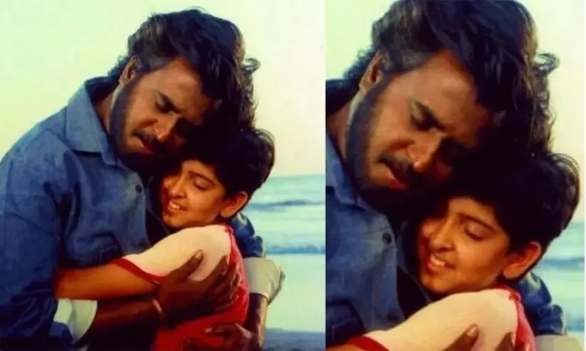 the child star in this photo with superstar rajnikanth