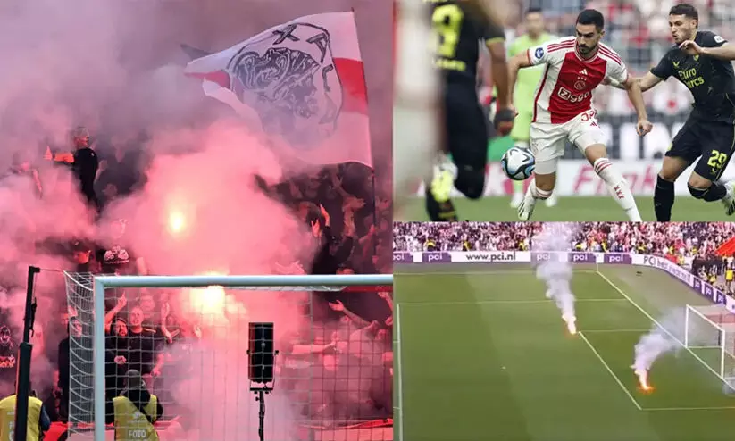 ഫുട്ബാളിൽ വീണ്ടും നാണക്കേടിന്റെ ‘കളി’; ഡച്ച് ലീഗിനിടെ ഗ്രൗണ്ടിലും ഗാലറിയിലും തീയിട്ട് അയാക്സ് ആരാധകർ ഫുട്ബാളിൽ വീണ്ടും നാണക്കേടിന്റെ ‘കളി’; ഡച്ച് ലീഗിനിടെ ഗ്രൗണ്ടിലും ഗാലറിയിലും തീയിട്ട് അയാക്സ് ആരാധകർ