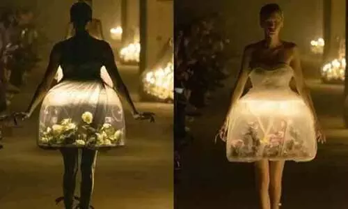 വസ്ത്രത്തിനകത്ത് ജീവനുള്ള ചിത്രശലഭങ്ങളും പൂക്കളും; വൈറലായി പാരീസ് ഫാഷൻ വീക്കിലെ മോഡൽ