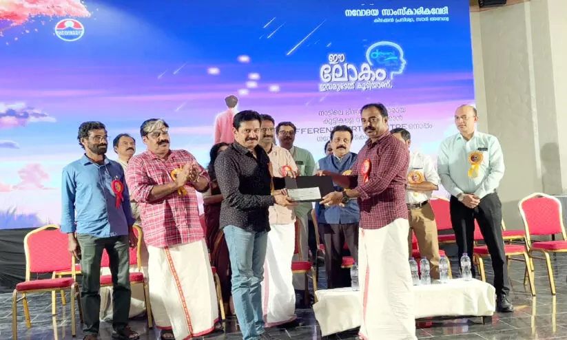 Gopinath Muthukad Receiving the Navodaya Rakshadhikari Pavanan Relief Fund Gopinath Muthukad Receiving the Navodaya Rakshadhikari Pavanan Relief Fund