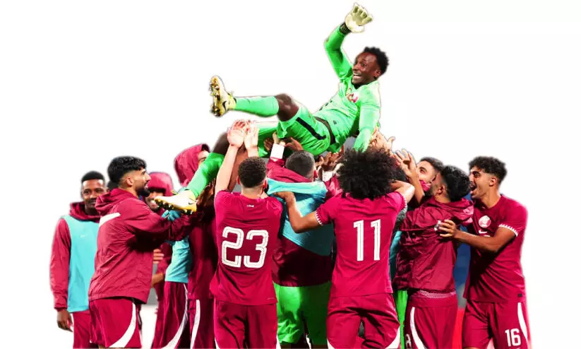 A member of the Qatariteam shares their happiness with the goalie Mishal Barshim