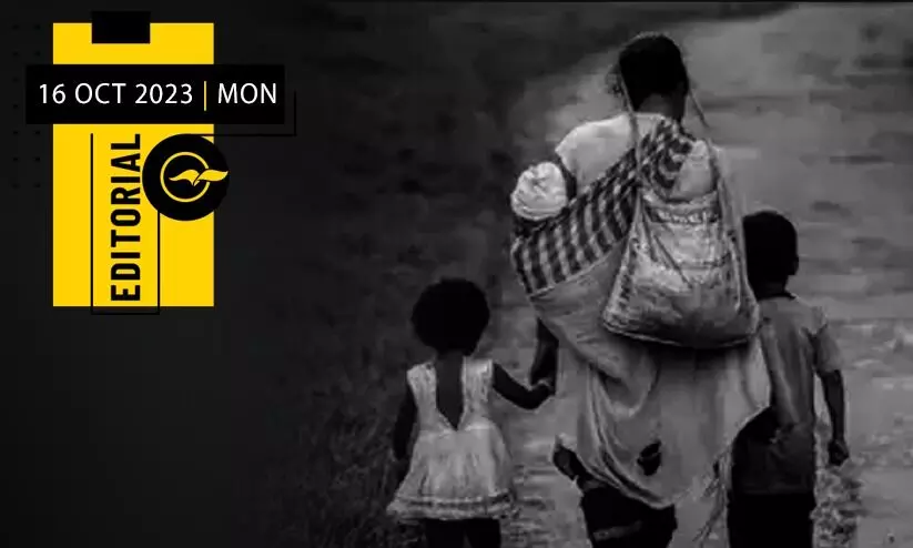 a poor lady walking with two kids