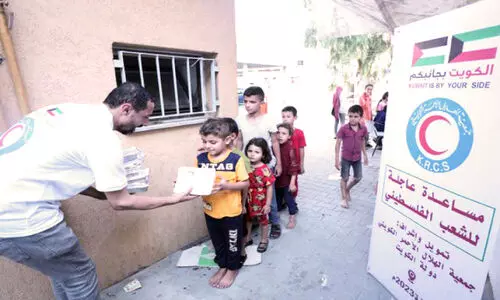 KRCS Members Distributing Food Items